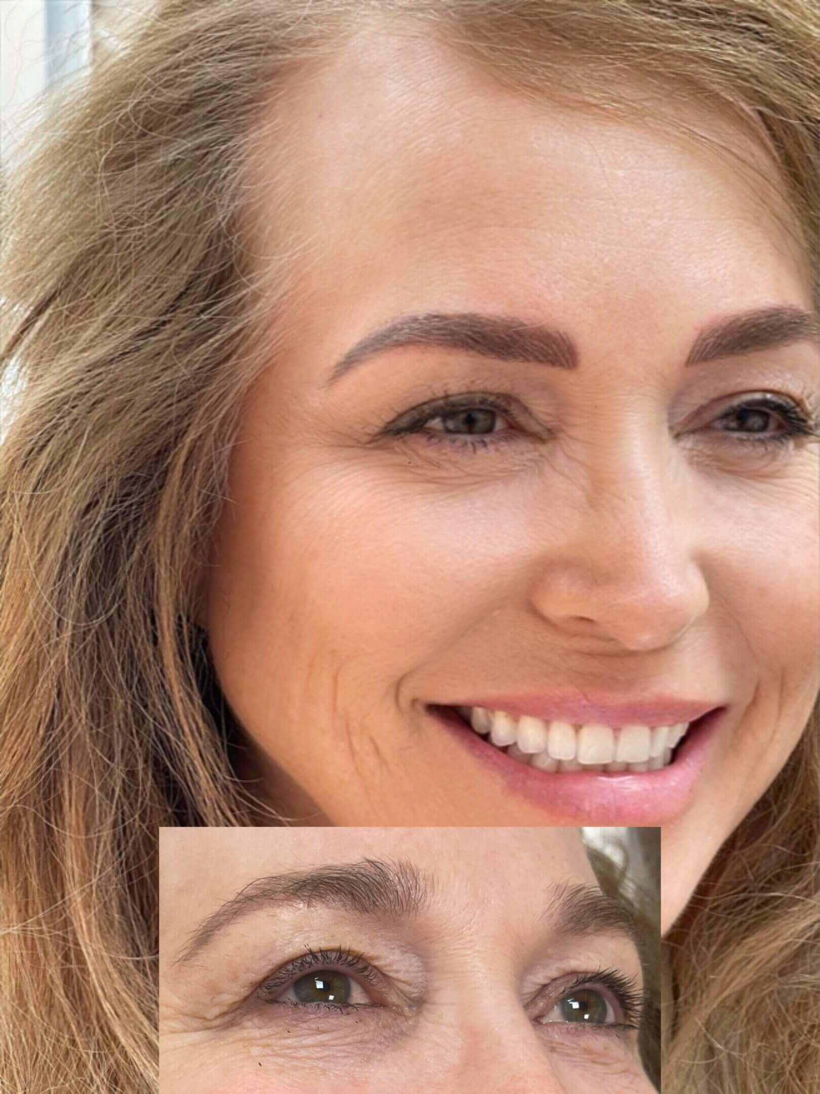 Close-up of a smiling woman with light brown hair and natural makeup.