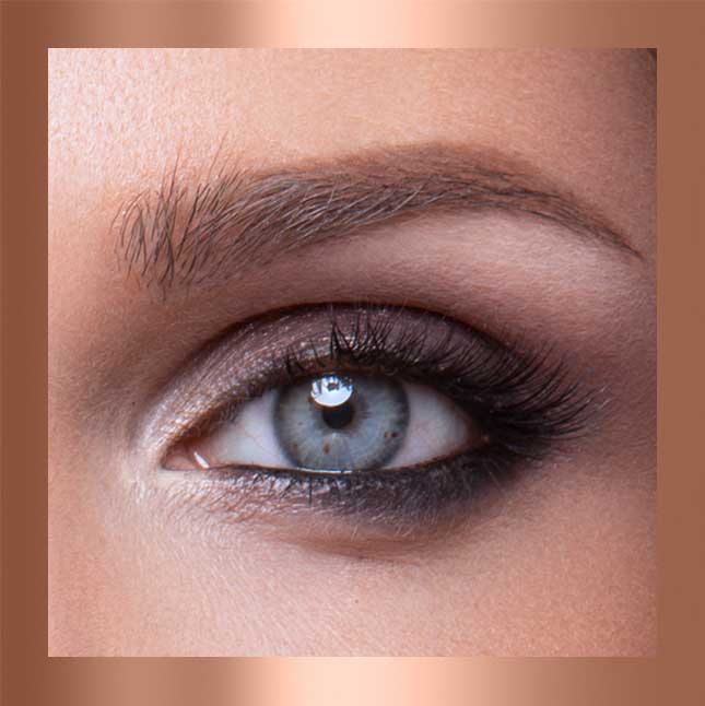 Close-up of a blue eye with detailed makeup.