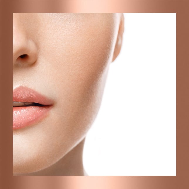 Close-up of a woman's lower face with smooth skin and light pink lips.